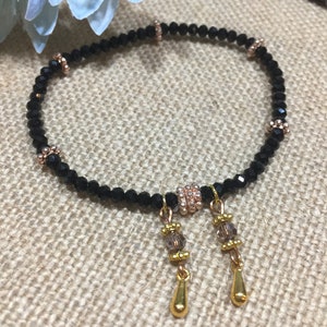 Black Crystal Bracelet, Stretch Bracelet, Boho Style, Daisy Spacer Beads, Gold Drop Dangles