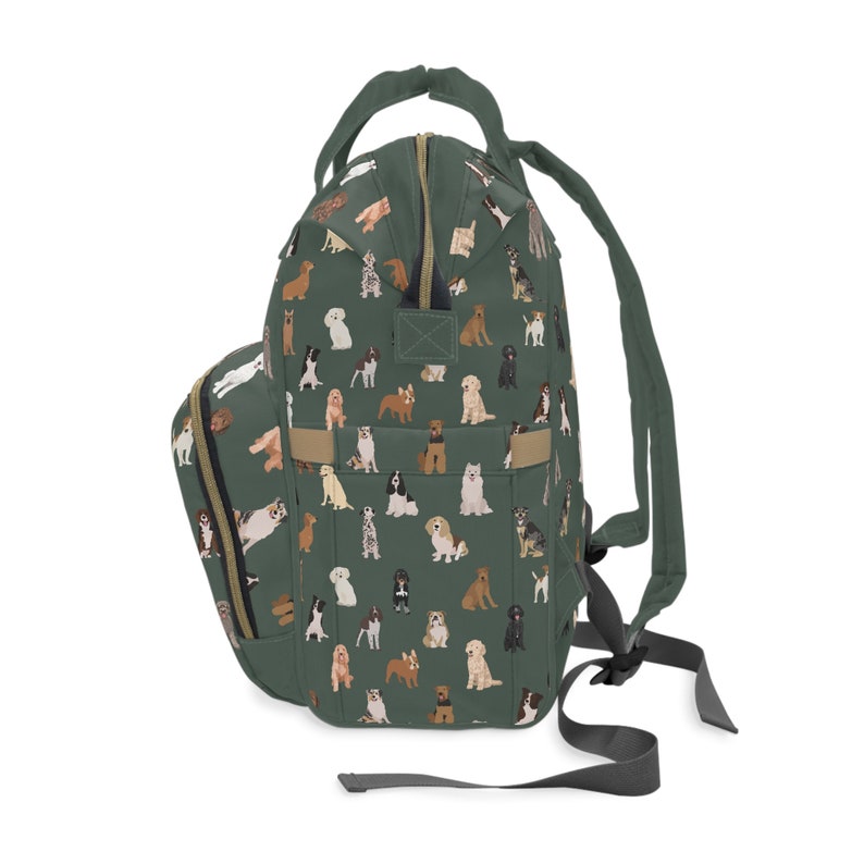 May include: A green backpack with a pattern of various dog breeds. The backpack has adjustable straps and a zippered front pocket.