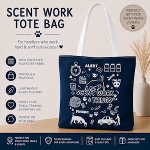 May include: Navy blue tote bag with white handles, featuring the text "SCENT WORK TOTE BAG" and various dog-related illustrations. The bag is made of 100% polyester fabric and is designed for scent work trials and everyday use.