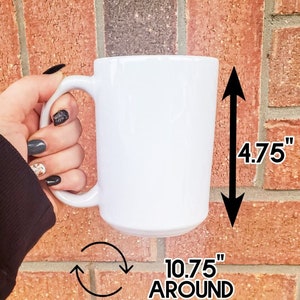 May include: White ceramic mug with a handle. The mug is 4.75 inches tall and 10.75 inches around.