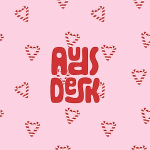 May include: Red and white candy cane hearts on a pink background with the text "Ads Desk" in red.