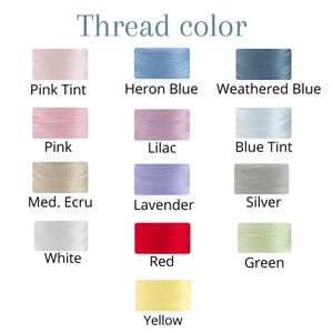 May include: A chart showing 12 different thread colors, including pink tint, heron blue, weathered blue, pink, lilac, blue tint, medium ecru, lavender, silver, white, red, green, and yellow.