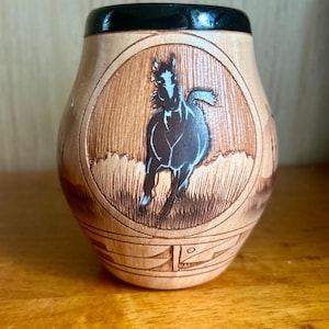 Navajo etched, vase pottery with horses and Southwestern imagery.