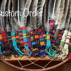 Custom peyote beaded smudge or grad feather. Your choice of colors and finish.