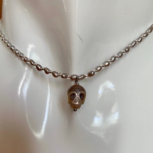 Extra dainty, freshwater pearl choker necklace with cultured skull pearl pendant.