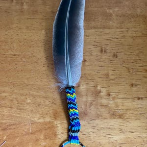 Small travel smudge feather with matching beaded chain. Rearview mirror charm with cedar smudge stick.