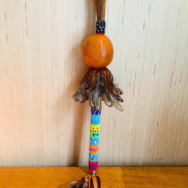 Gourd rattle with peyote beaded handle. Hand crafted with horse hair.