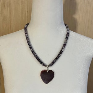 Wampum shell necklace with reversible wampum heart pendant.