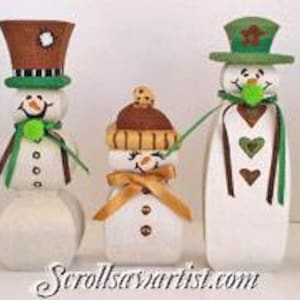 May include: A collection of seven handcrafted snowman figurines. Each snowman has a unique design, featuring painted faces, hats, scarves, and decorative accents. The snowmen are painted in various colors, including blue, pink, green, and brown.