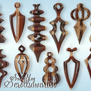 May include: A collection of 14 intricately carved wooden ornaments in various shapes and sizes. The ornaments are made from different types of wood, including maple, cherry, and walnut. They are all finished in a natural wood stain and have a glossy finish. The ornaments are all unique and have a beautiful, handcrafted look. Sue Riley Scrollsawartist.