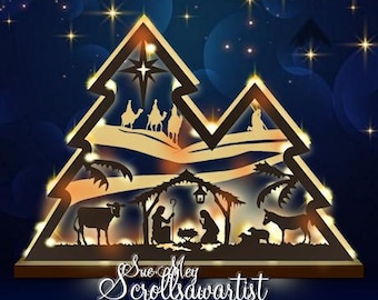 May include: A Christmas-themed wooden silhouette in the shape of a stylized Christmas tree. The design features a nativity scene with the three wise men, a star, and the text "Sue Mey Scrollsawartist". The background is a gradient of blue and gold with sparkling lights.