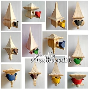 May include: A collage of wooden birdhouses with various designs. Each birdhouse features a unique shape and is adorned with a colorful bird figure. The birdhouses are made of light-colored wood and have a rustic, handcrafted appearance.
