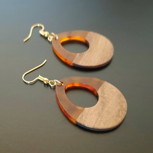 Orange wooden earrings in teardrop shape with hole, walnut wood and synthetic resin (dark orange), individual hanging earrings handmade), 5 cm long