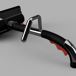 Puede incluir: Una herramienta de limpieza de mano negra y cromada con un mango rojo y una boquilla. La herramienta tiene una cabeza de limpieza rectangular con un cepillo negro.