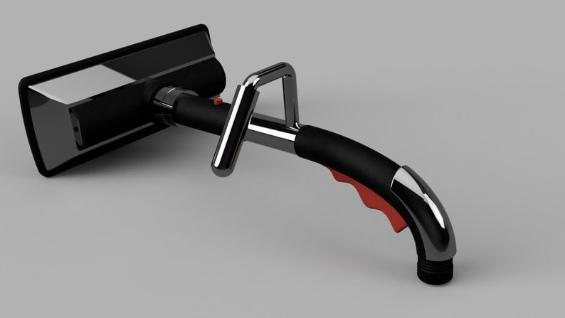 Puede incluir: Una herramienta de limpieza de mano negra y cromada con un mango rojo y una boquilla. La herramienta tiene una cabeza de limpieza rectangular con un cepillo negro.