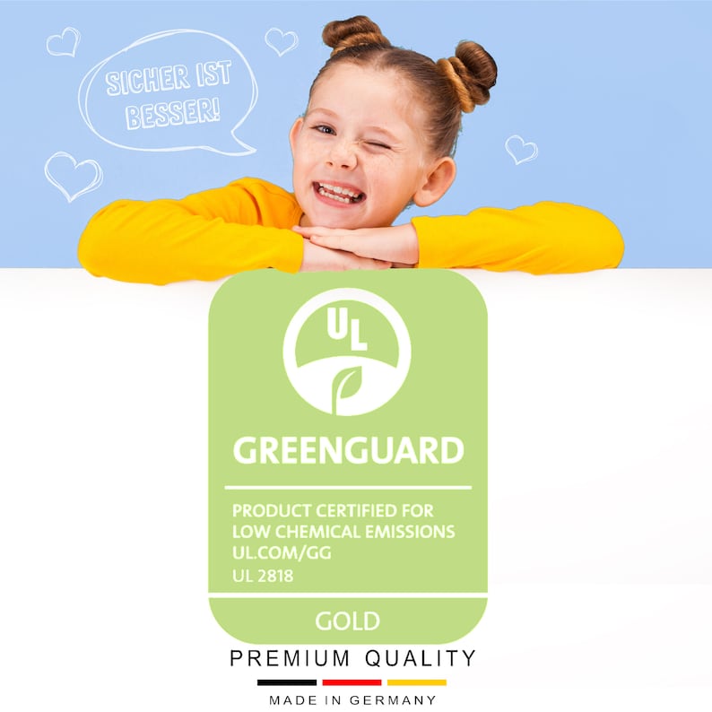May include: A green and white GreenGuard certified product label with the text "UL" in a circle, "GREENGUARD", "PRODUCT CERTIFIED FOR LOW CHEMICAL EMISSIONS", "UL.COM/GG", "UL 2818", "GOLD", "PREMIUM QUALITY", and "MADE IN GERMANY".