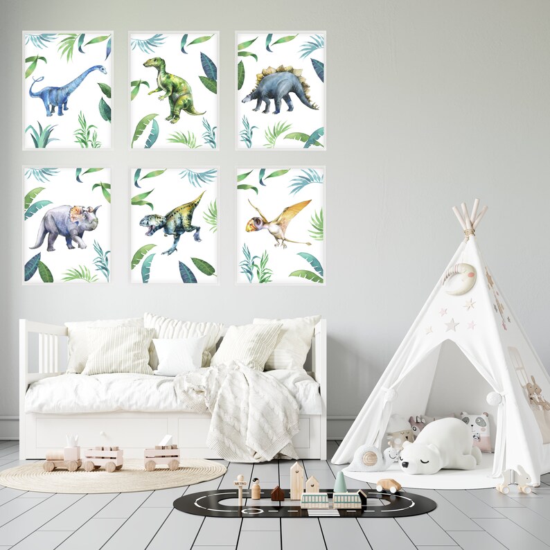 May include: Six watercolor dinosaur prints with green leaves on a white background. The dinosaurs are blue, green, yellow, and brown. The prints are framed in white and are displayed on a white wall above a white couch.