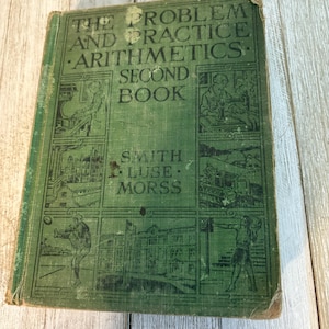 May include: A vintage green arithmetic textbook titled "The Problem and Practice Arithmetics Second Book" by Smith, Luse, and Morss. The cover features illustrations and text in white, with a worn appearance.