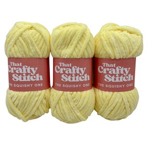 May include: Three skeins of yellow yarn labeled "That Crafty Stitch The Squishy One"