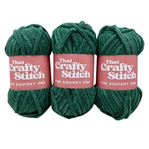 May include: Three skeins of green yarn labeled "That Crafty Stitch The Squishy One".