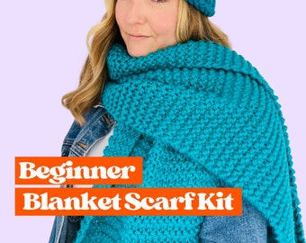 May include: A teal blue knitted scarf kit for beginners. The kit includes yarn and instructions to make a large, chunky scarf.
