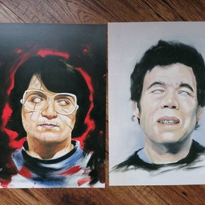 May include: Two portrait prints. The first features a person with glasses, dark hair, and a red and black background. The second print shows a person with dark hair and a black shirt. Both portraits have a similar style.