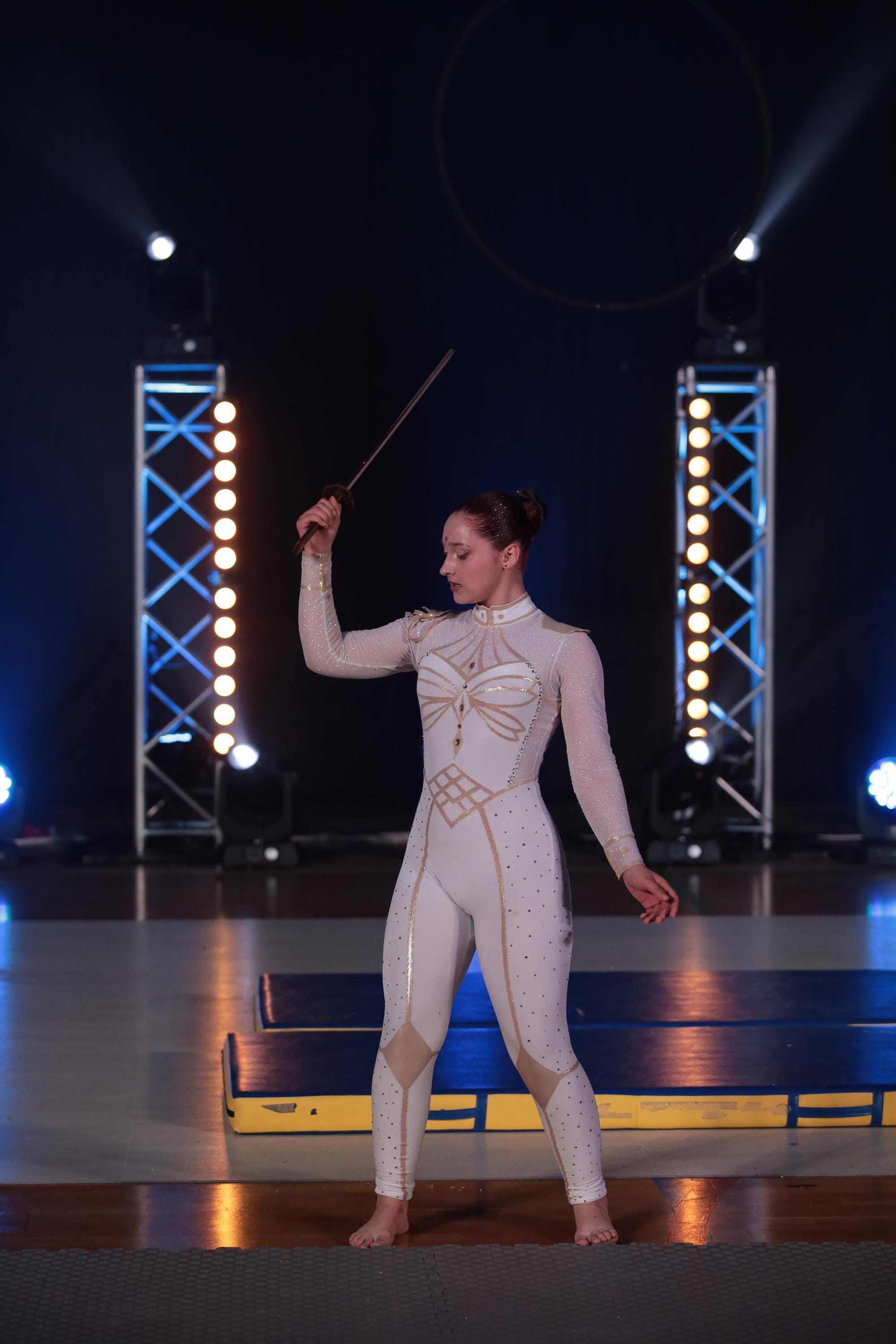 White and gold Velvet warrior style leotard with rhinestones for aerial performance