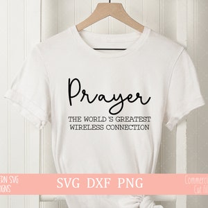 May include: White t-shirt with black text that reads "Prayer The World's Greatest Wireless Connection".