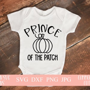 May include: White baby onesie with black text that reads "Prince of the Patch" and a black outline of a pumpkin.