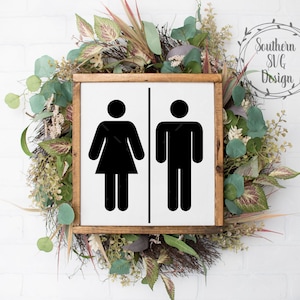May include: A wooden sign with a white background and black silhouettes of a female and male figure. The sign is surrounded by a green and brown floral wreath. The text "Southern SVG Design" is in a gray circle above the sign.