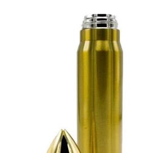 May include: A gold-colored, bullet-shaped water bottle with a matching cap. The bottle has a metallic finish and a silver-colored top. The cap is cone-shaped with a hollowed-out tip. The bottle is designed to resemble a large bullet.