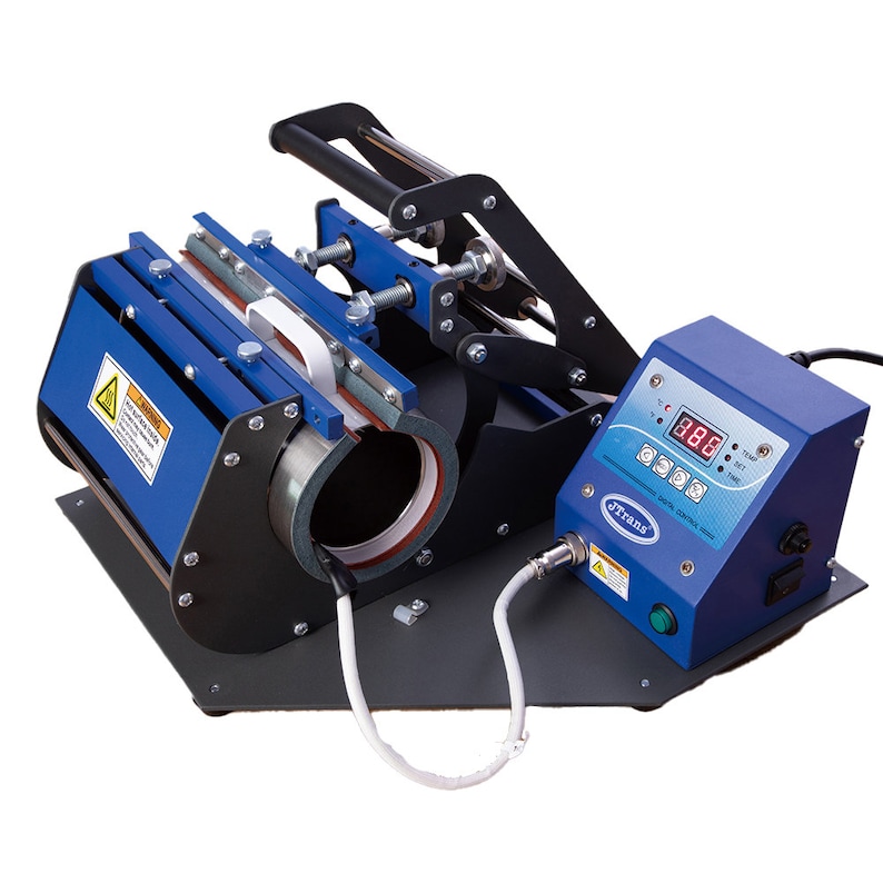 May include: A blue and black mug heat press machine with a digital control panel. The machine has a cylindrical heating element and a handle for pressing. The control panel displays temperature settings.