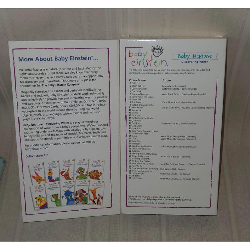 May include: Two Baby Einstein DVD cases. One case has the title "More About Baby Einstein..." and the other says "Baby Neptune Discovering Water". The cases feature text and images of the Baby Einstein characters.