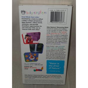 May include: A Baby Einstein "Baby Neptune Discovering Water" VHS video. The rear of the video features text and images, including a child with an umbrella and a cartoon duck. The video runs for approximately 30 minutes.