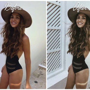 May include: A woman wearing a black swimsuit with a mesh design and a wide-brimmed brown hat. The woman is standing in front of a white wall with a slatted window.