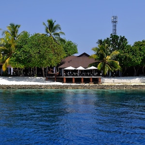 Maldives Island, with Pristine White Sand Beach & Crystal-clear Lagoon with Piers in South Asia in the Indian Ocean Canvas Print - CW 1871