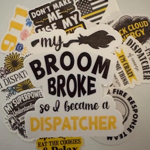 May include: A collection of white stickers with black and yellow text. One sticker reads "My Broom Broke so I became a Dispatcher." Other stickers have phrases like "Don't Make Me Use My Dispatcher Voice" and "Eat the Cookies & Relax."