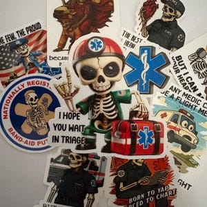 May include: A collection of stickers featuring skeleton paramedics and medical symbols. The stickers include phrases like "I hope you wait in triage" and "Born to yap, forced to chart." The color palette includes red, blue, and white.