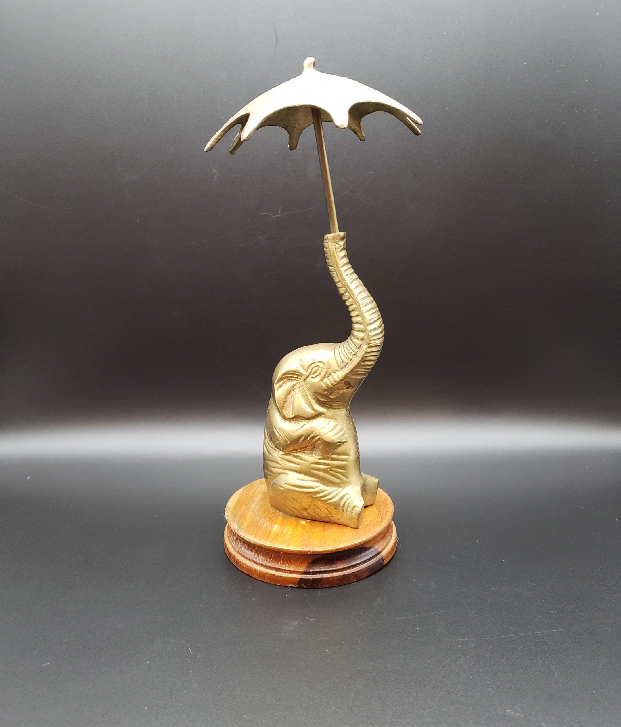 Brass elephant holding umbrella with trunk on wooden base with Etsy
