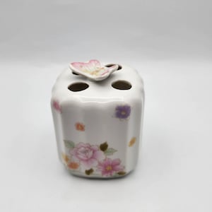 Butterfly and flowers toothbrush holder
