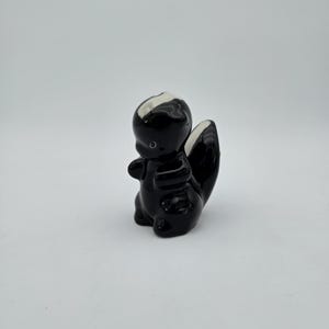 Skunk figurine