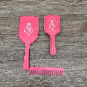 Vintage pink child&#39;s three-piece vanity set / Mirror Brush and Comb set