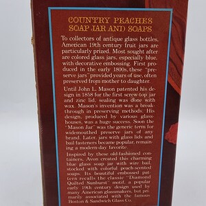 May include: A brown box with text that reads "COUNTRY PEACHES SOAP JAR AND SOAPS." The text describes antique glass bottles and soap jars. The box has a blue border and is on a white background.