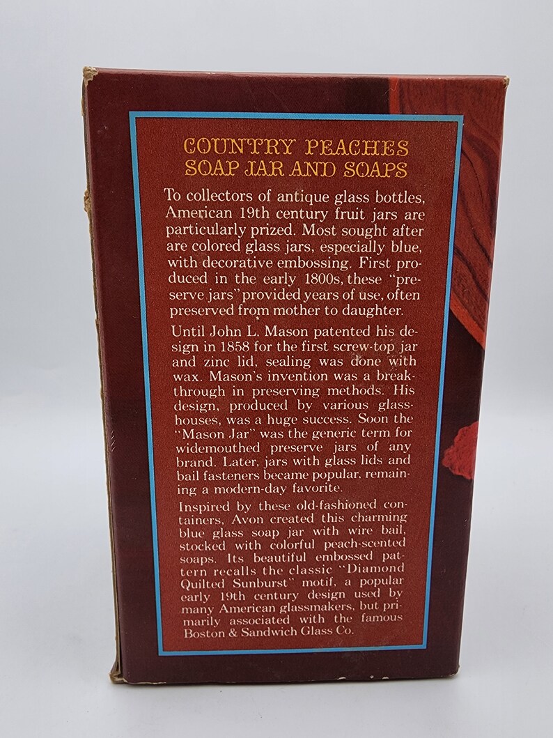 May include: A brown box with text that reads "COUNTRY PEACHES SOAP JAR AND SOAPS." The text describes antique glass bottles and soap jars. The box has a blue border and is on a white background.