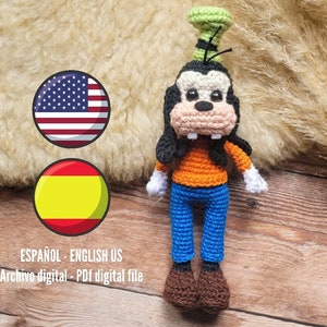 May include: Crochet amigurumi pattern for a goofy character with a green hat, orange shirt, blue pants, and brown shoes. The pattern is available in both English and Spanish.  ESPAÑOL - ENGLISH US Archivo digital - PDF digital file