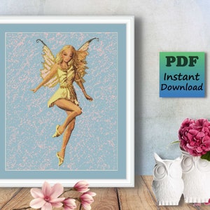 May include: A framed cross-stitch pattern of a fairy with blonde hair, wearing a yellow dress and wings, against a light blue background. The artwork is in a white frame. Text on the image reads "PDF Instant Download".