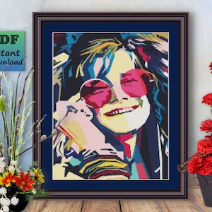 Può includere: Un ritratto colorato in stile pop art di una persona con occhiali da sole. La persona ha i capelli lunghi e sorride. Lo sfondo è un mix di colori vivaci.