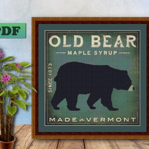 May include: A vintage-style illustration of a black bear silhouette with the text "Old Bear Maple Syrup Since 1873 Made in Vermont".
