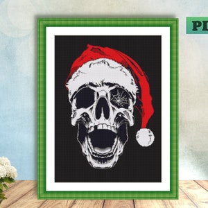 May include: A white skull wearing a red Santa hat with a white pom-pom. The skull has a cracked eye socket and an open mouth with teeth. The background is black.