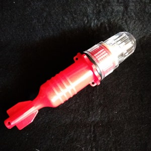 Luminous mini torpedo, ideal for rescue beacon boats